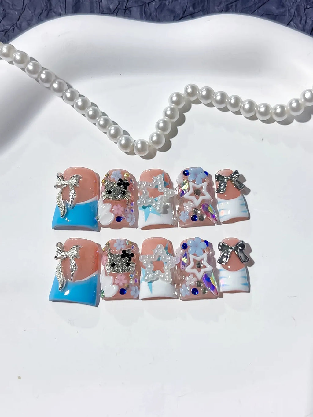 L262 - Short Nude Blue Duck Abstract Bow Flower