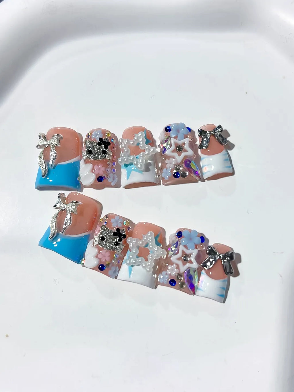 L262 - Short Nude Blue Duck Abstract Bow Flower