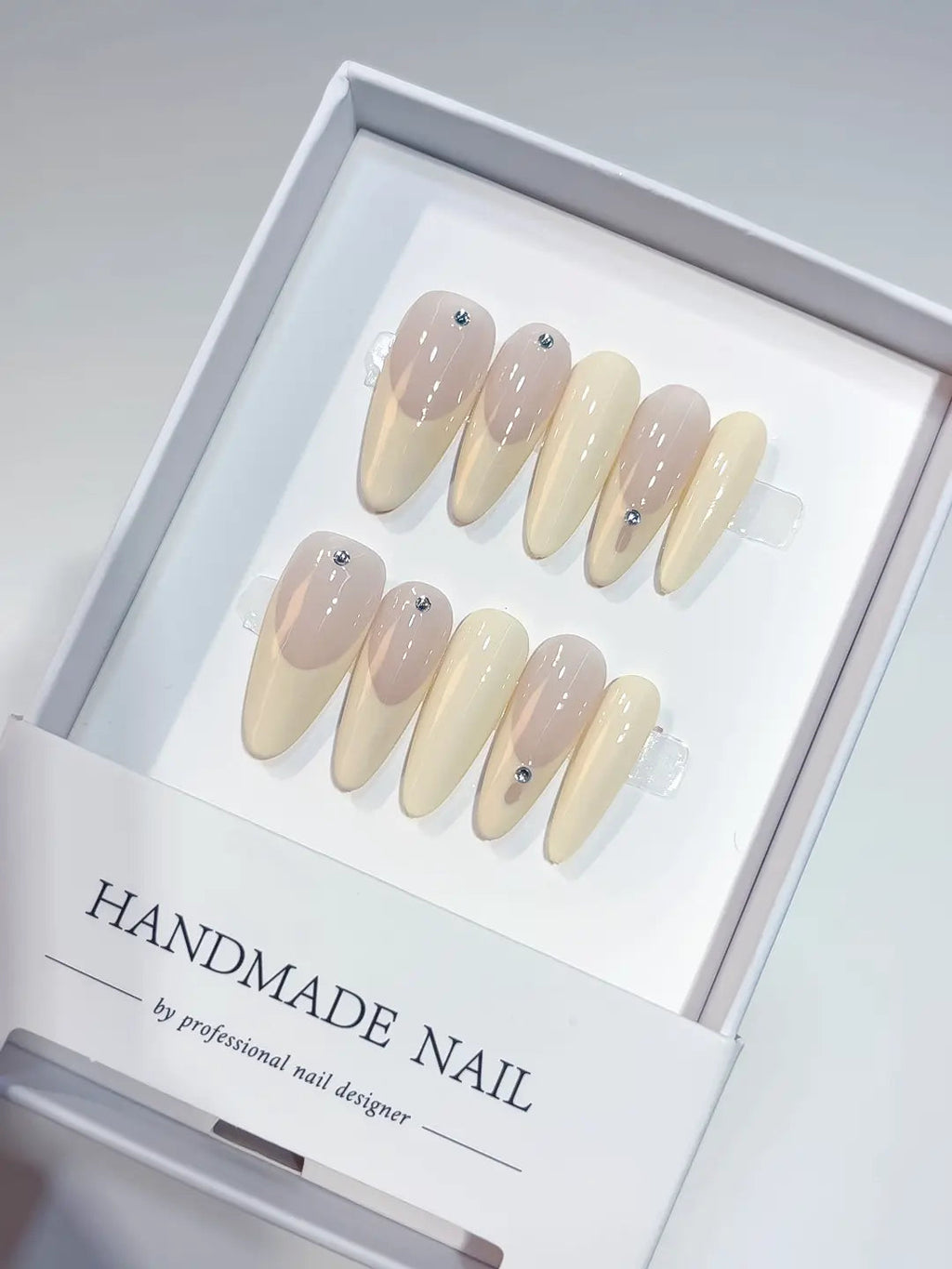 A071 - Long Nude Oval French tip Rhinestone VibeNailsLab