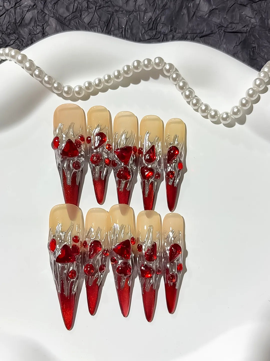 M009 - Long Red White Stiletto Abstract Bow Metallic Accent