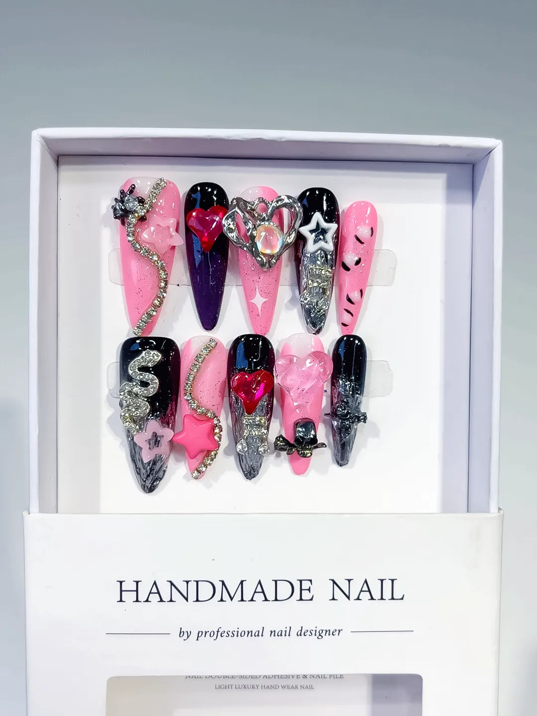M074 - Long Pink Black Stiletto Abstract Bow Flower