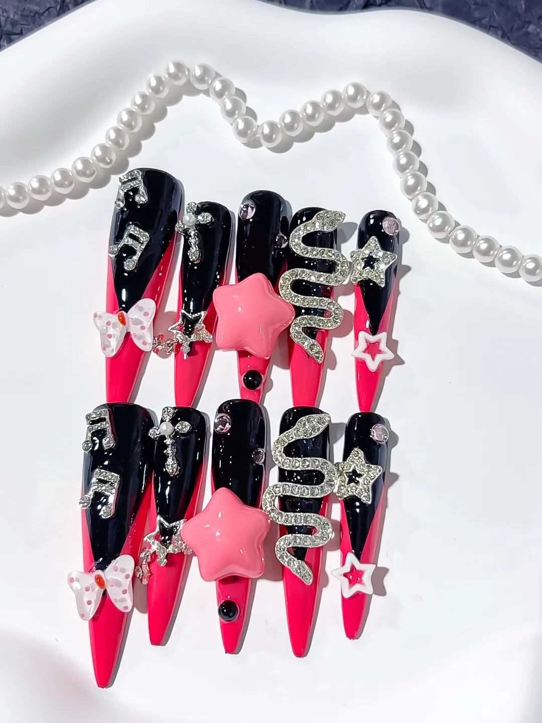 M101 - Long Pink Black Stiletto Abstract Bow Rhinestone