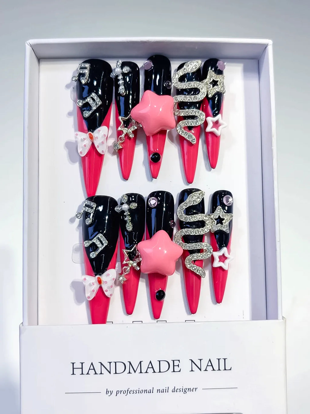 M101 - Long Pink Black Stiletto Abstract Bow Rhinestone