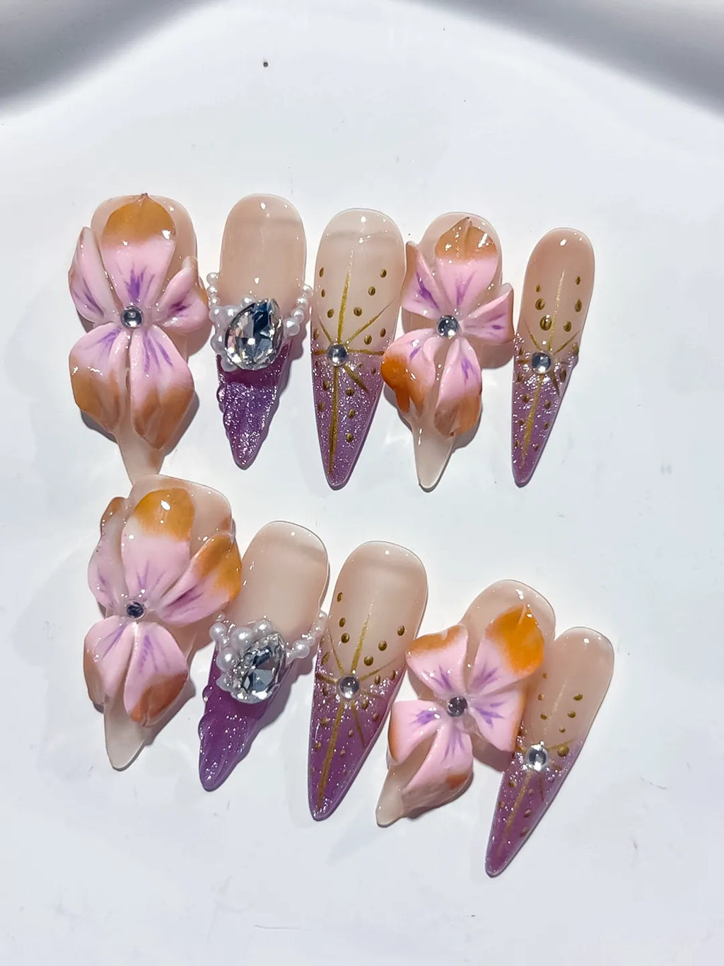 M117 - Long Nude Pink Stiletto Abstract Flower Rhinestone