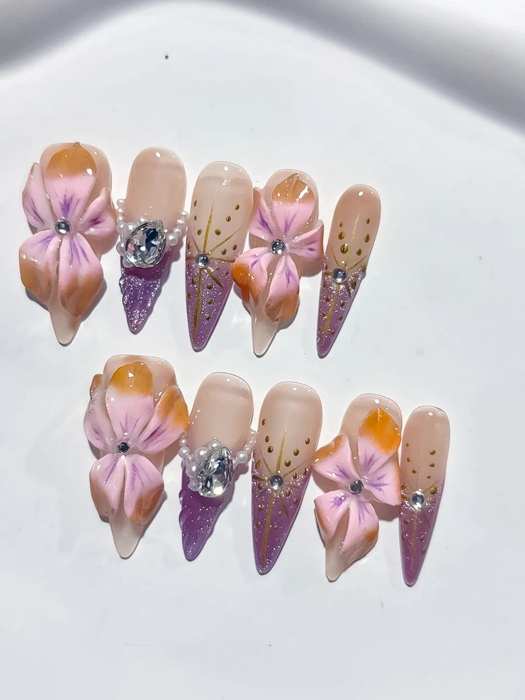 M117 - Long Nude Pink Stiletto Abstract Flower Rhinestone