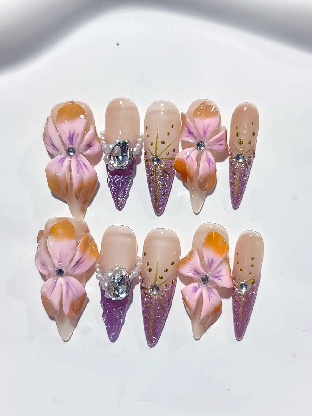 M117 - Long Nude Pink Stiletto Abstract Flower Rhinestone