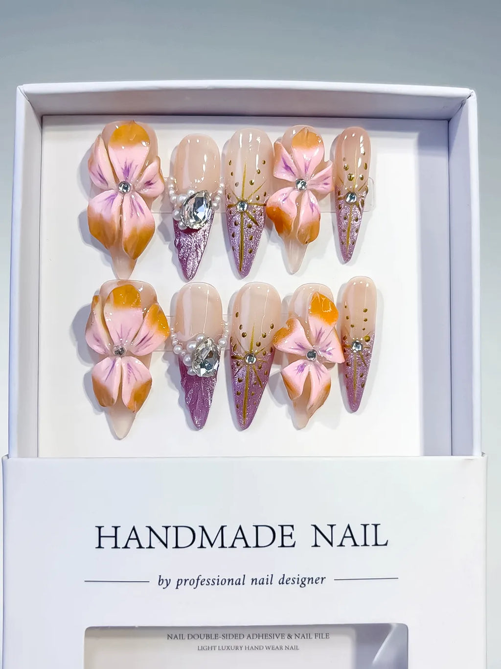 M117 - Long Nude Pink Stiletto Abstract Flower Rhinestone