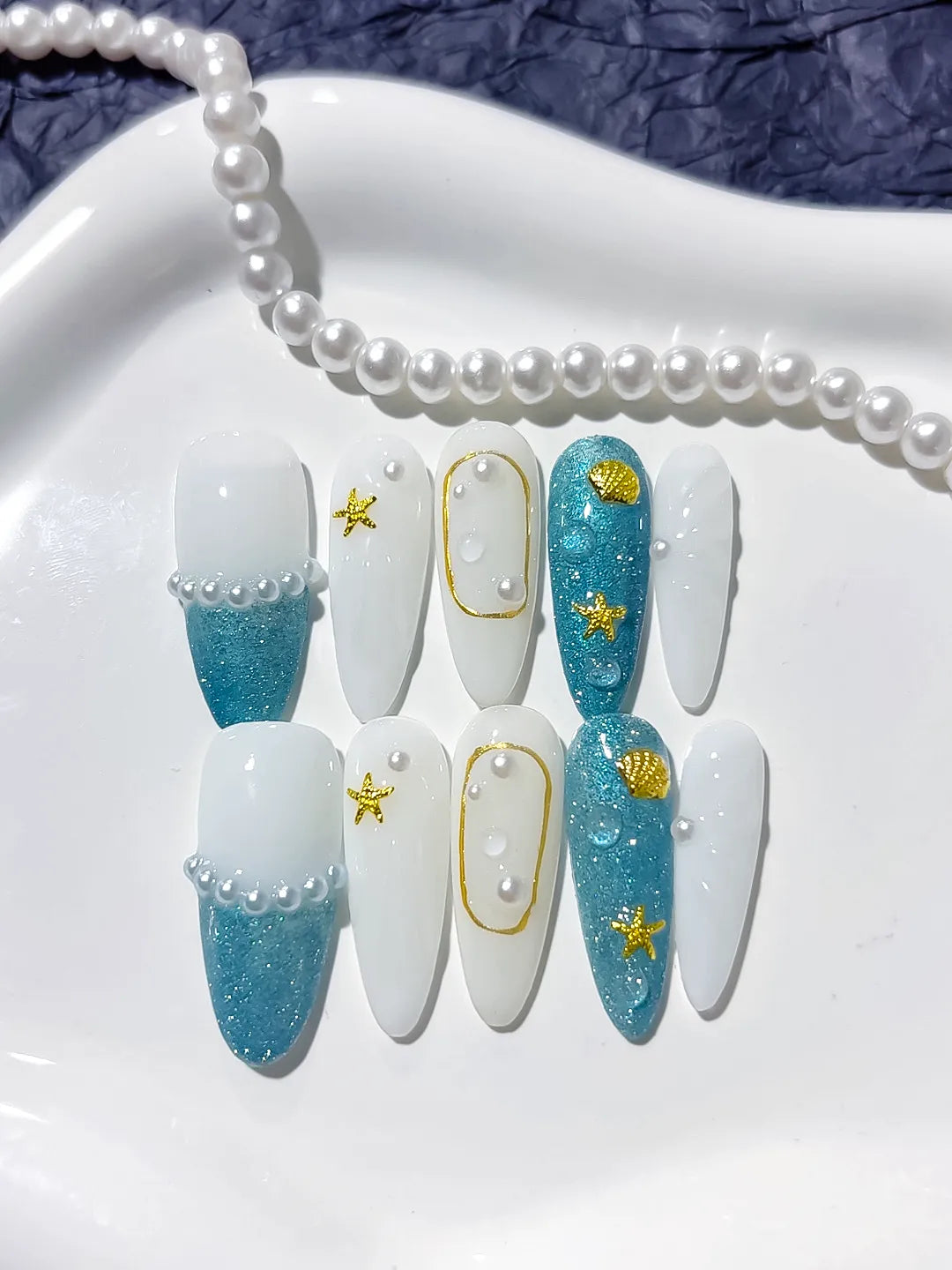 D275 - Medium Blue White Almond Glitter Starfish Shell