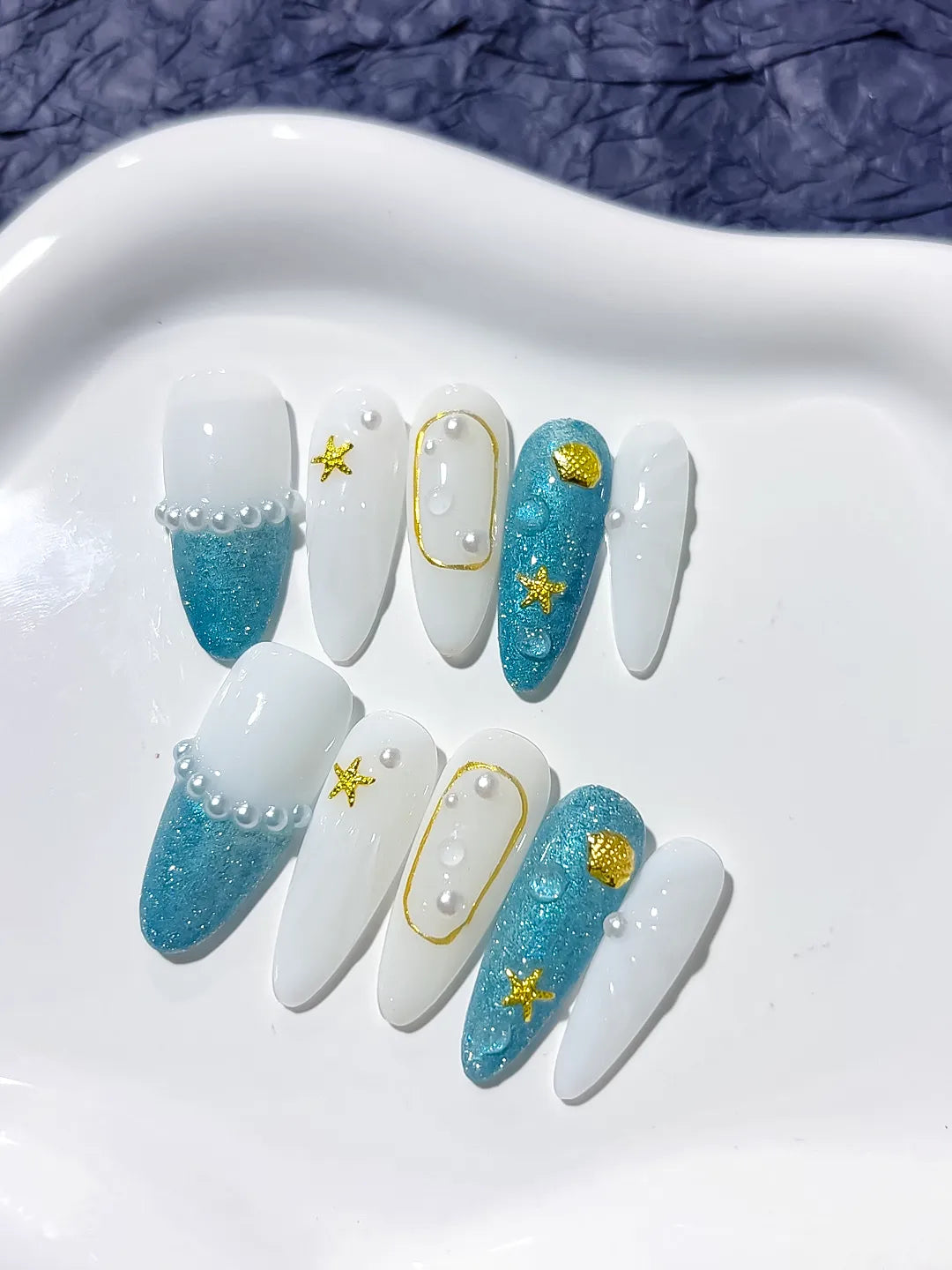 D275 - Medium Blue White Almond Glitter Starfish Shell