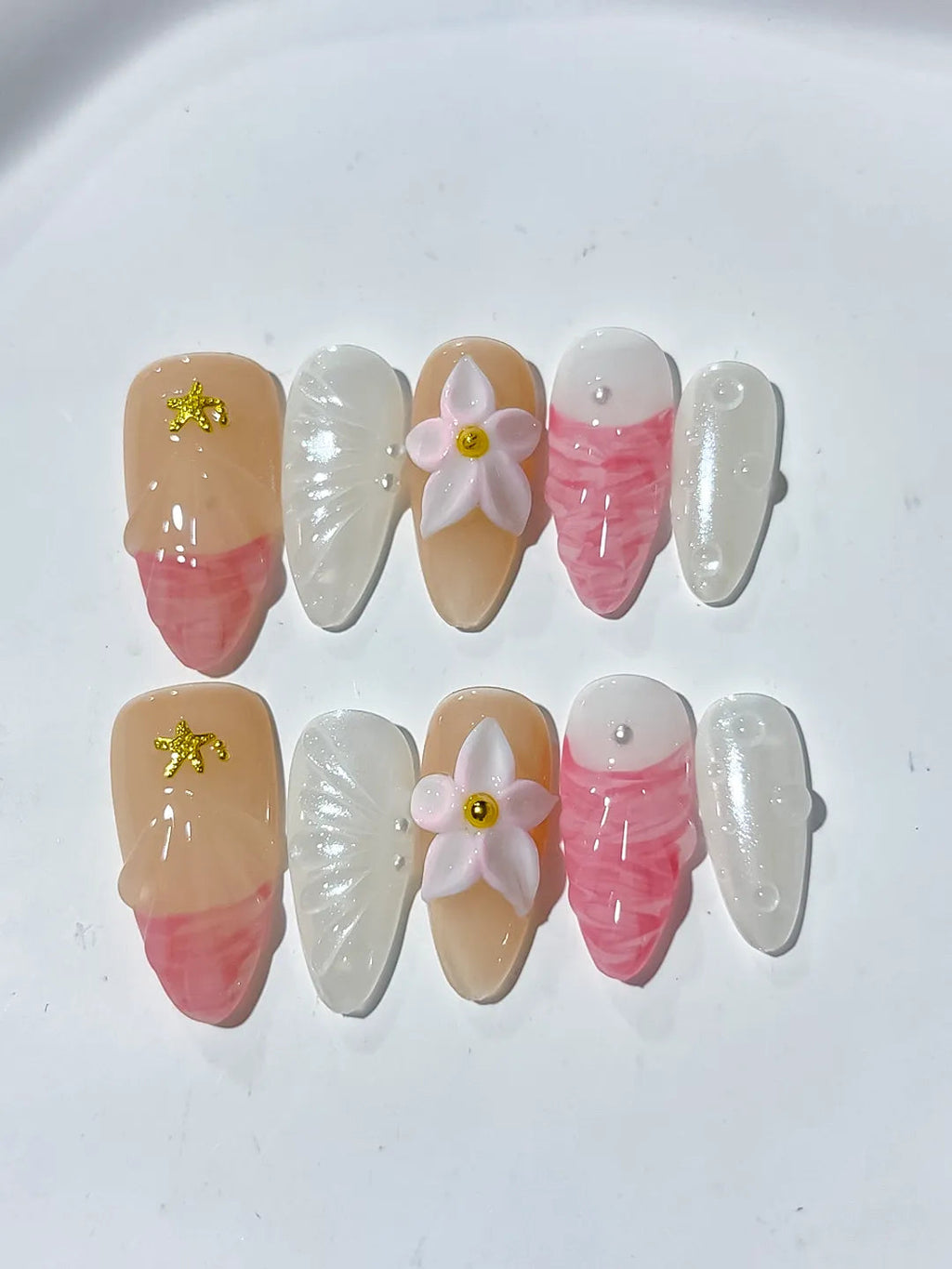 D338 - Medium Nude Pink Almond Abstract Flower Star VibeNailsLab
