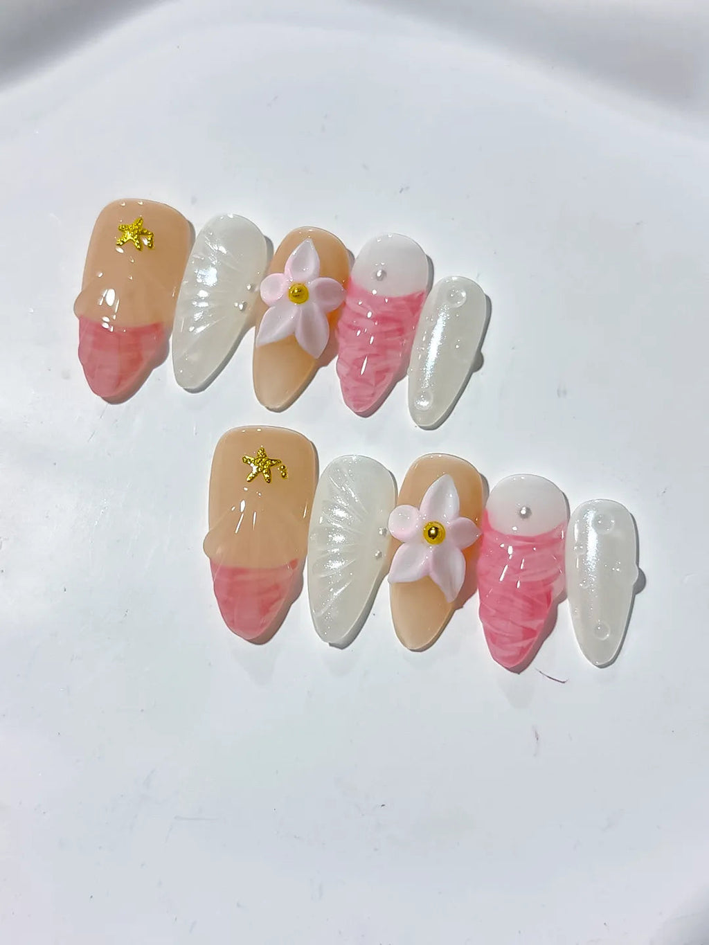 D338 - Medium Nude Pink Almond Abstract Flower Star VibeNailsLab