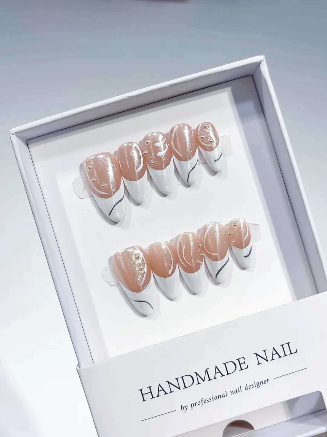 B094 - Medium White Nude Stiletto French tip Rhinestone Swirl VibeNailsLab