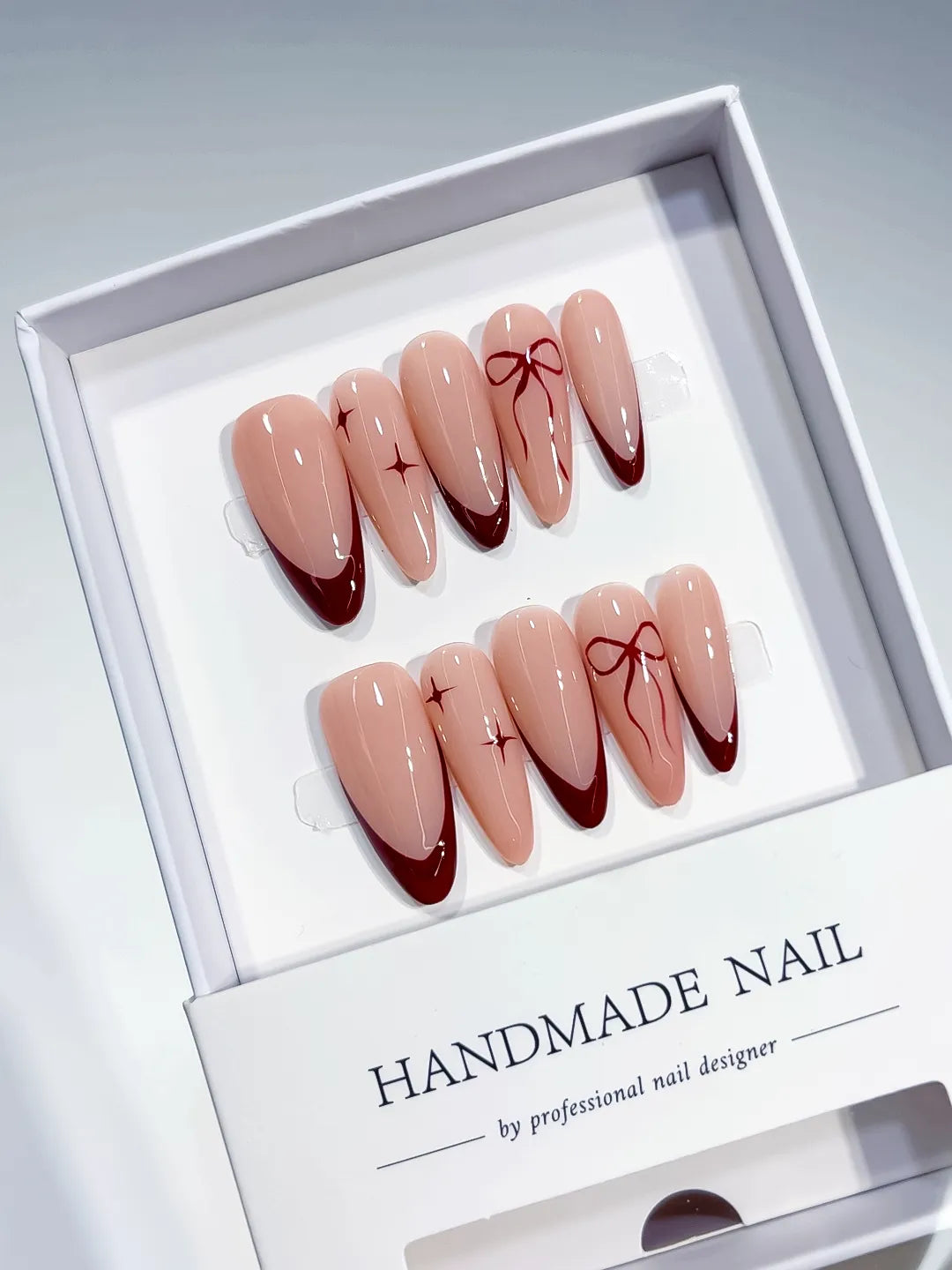B102 - Long Nude Red Almond French tip Bow