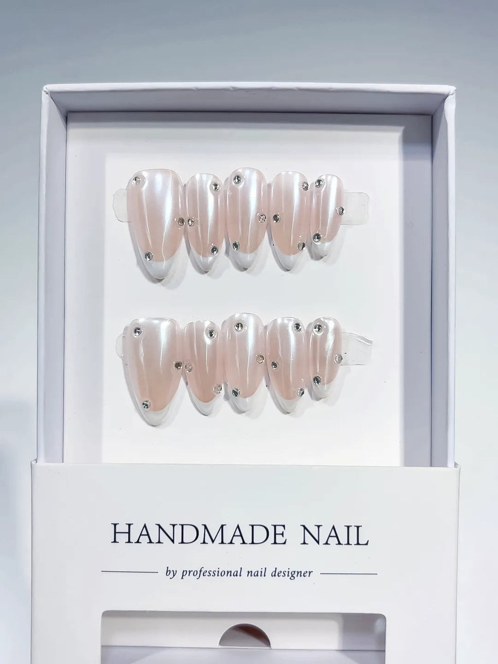 B104 - Medium Nude Almond French tip Rhinestone VibeNailsLab