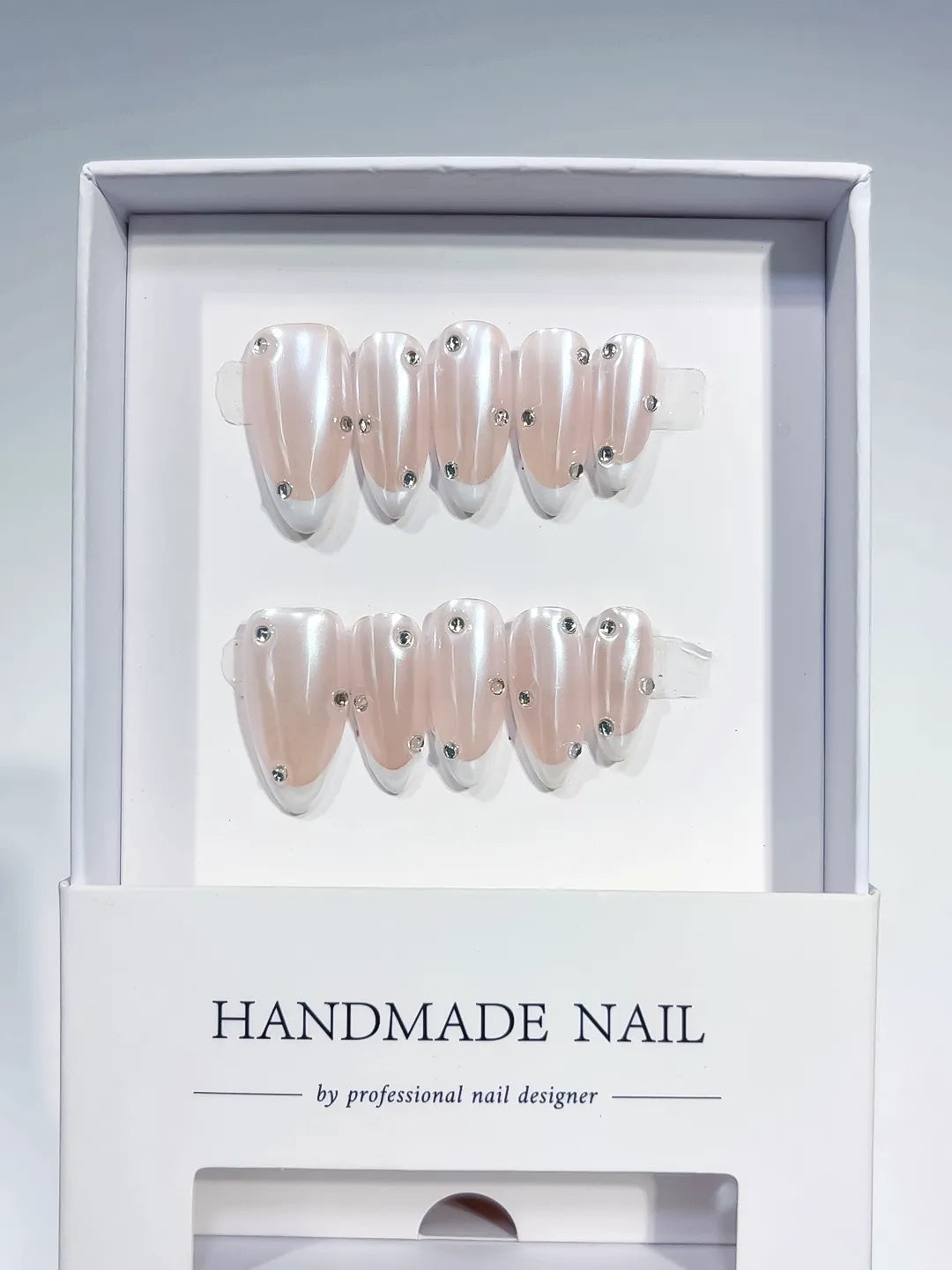 B104 - Medium Nude Almond French tip Rhinestone VibeNailsLab