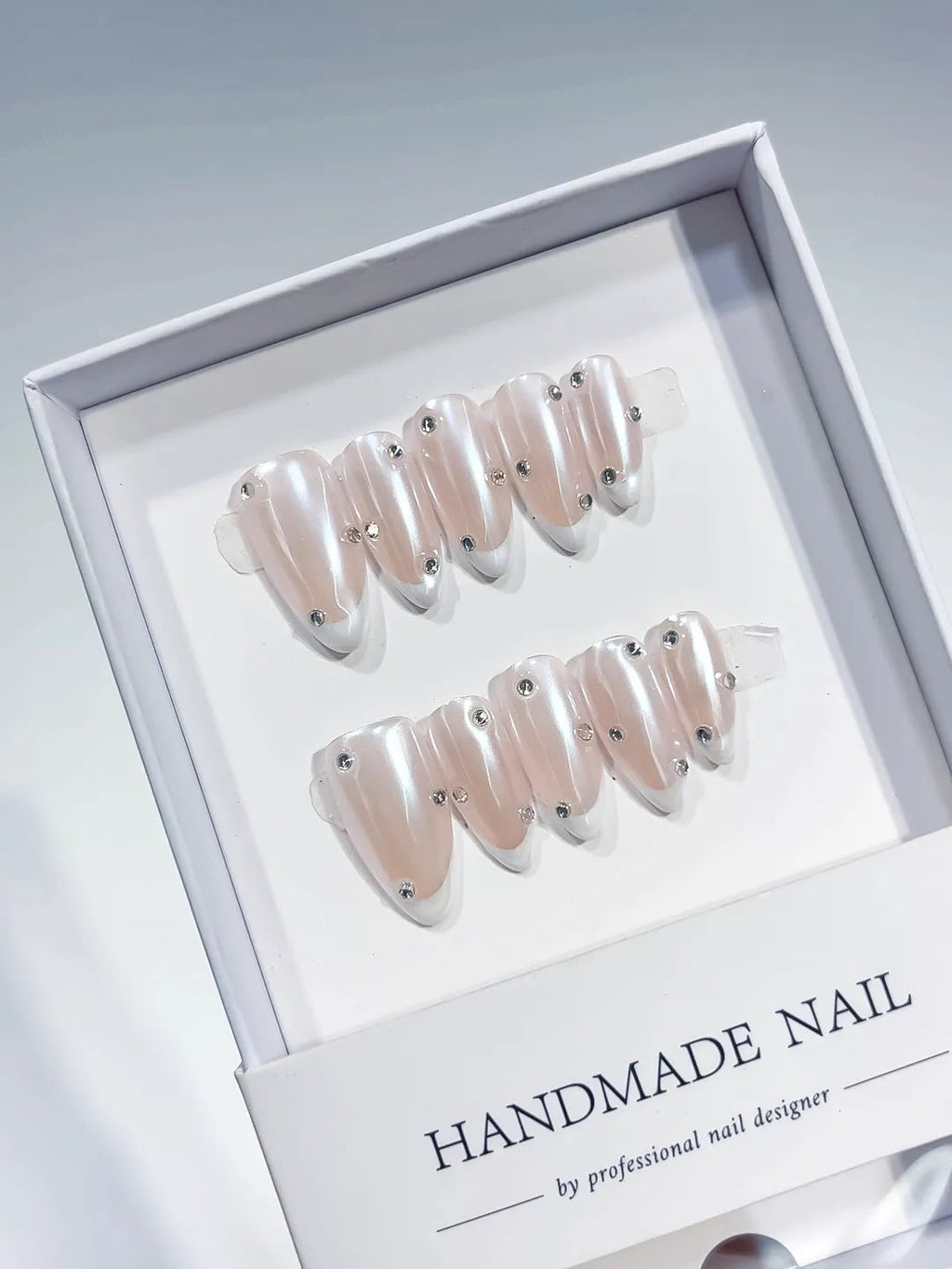 B104 - Medium Nude Almond French tip Rhinestone VibeNailsLab