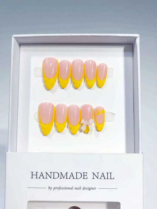 B117 - Medium Nude Yellow Almond French tip Bow VibeNailsLab