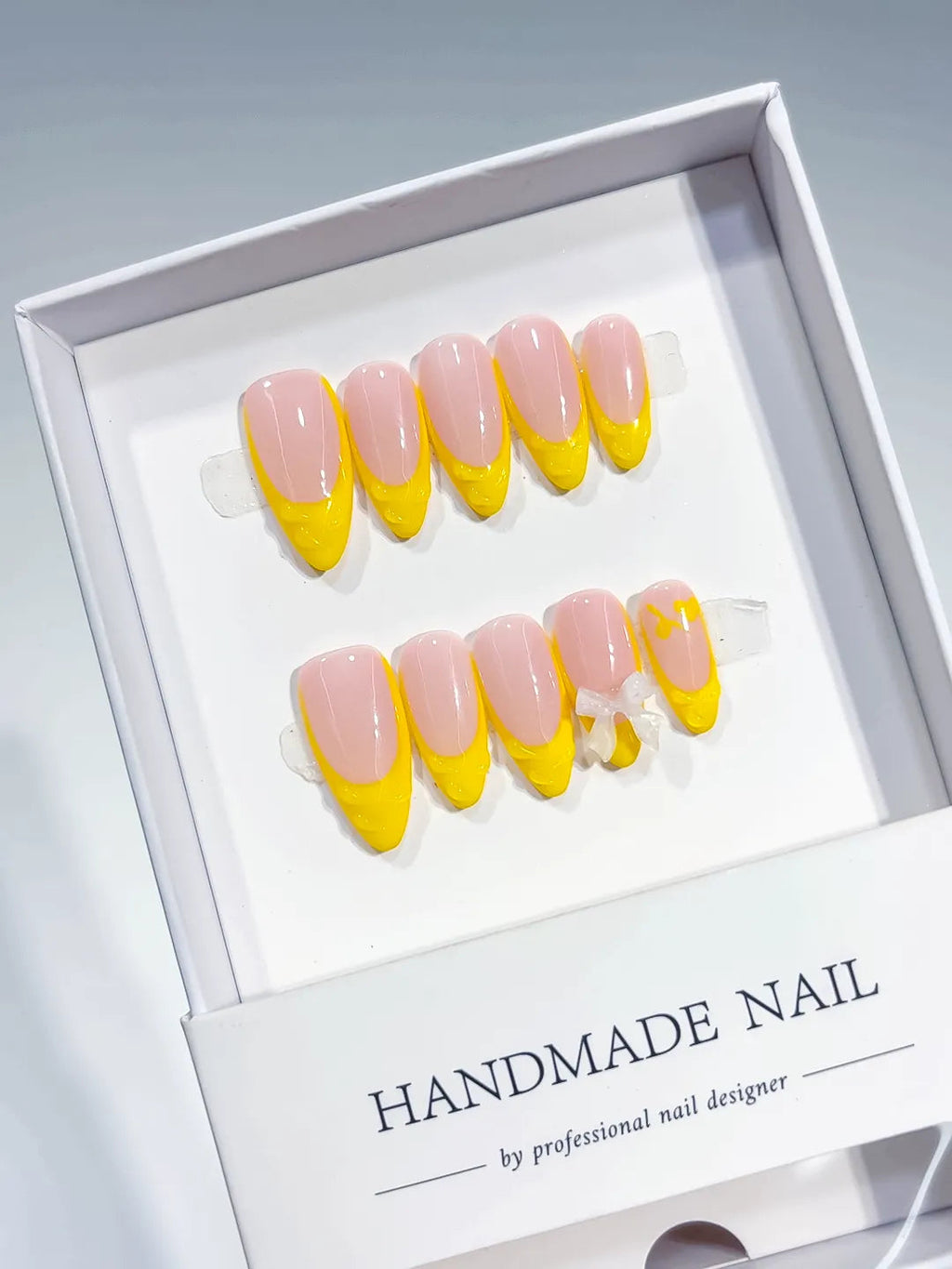 B117 - Medium Nude Yellow Almond French tip Bow VibeNailsLab