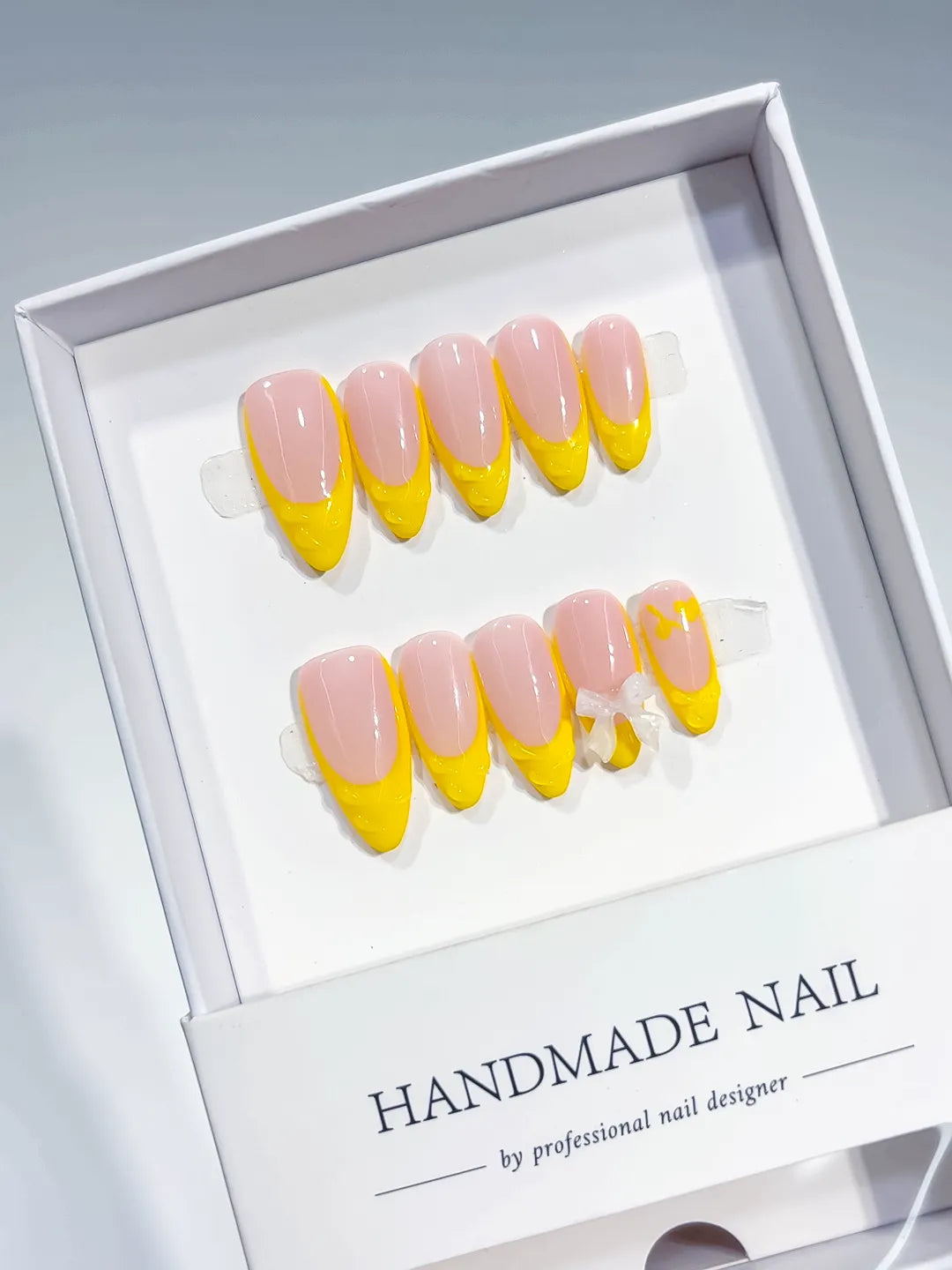 B117 - Medium Nude Yellow Almond French tip Bow VibeNailsLab
