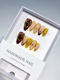B142 - Medium Red Gold Almond Metallic Star Gold Frame VibeNailsLab