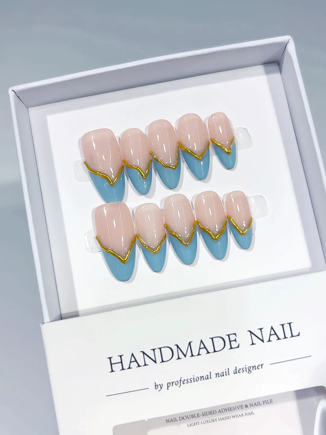 C406 - Medium Nude Blue Almond French tip Gold Outline VibeNailsLab