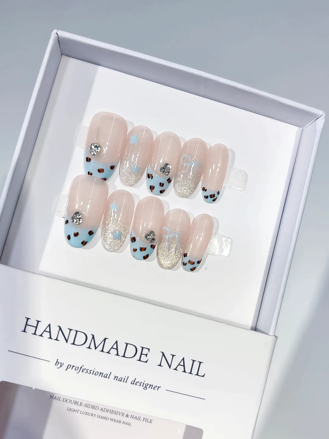 C416 - Medium Nude Blue Oval French tip Animal Print Glitter