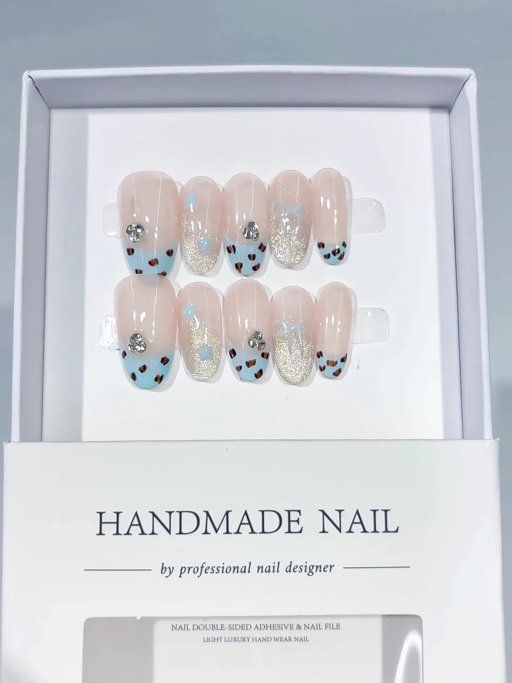 C416 - Medium Nude Blue Oval French tip Animal Print Glitter