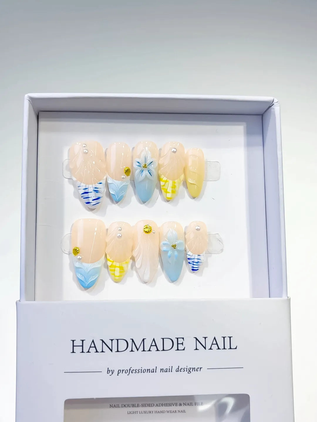D327 - Medium Nude Blue Almond French tip Flower Grid Pattern VibeNailsLab