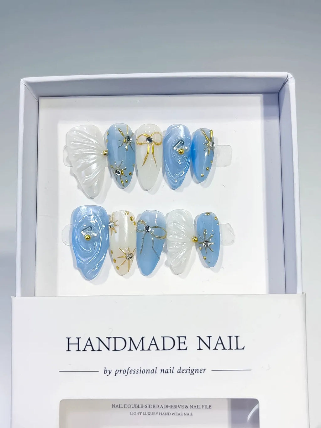 D357 - Medium Blue White Almond Holographic Shell Bow
