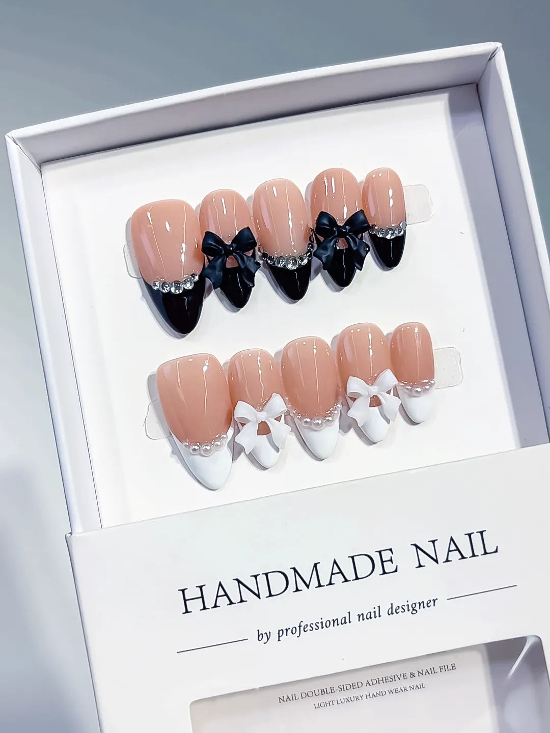 C451 - Medium Nude Black Almond French tip Bow Pearl VibeNailsLab